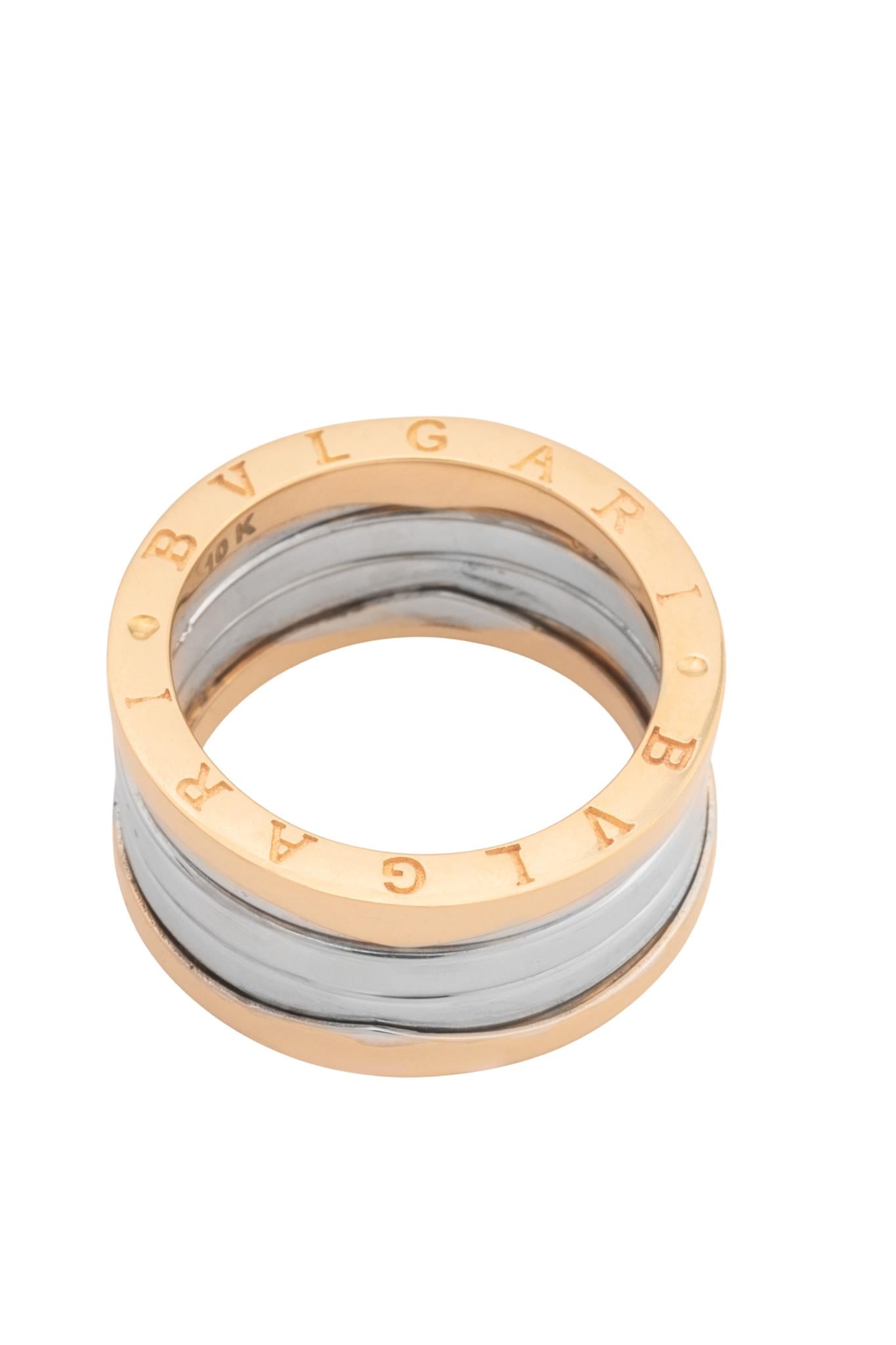 Anillo 10 kilates forma de cilindro parte superior e inferior dorada centro en oro blanco.png