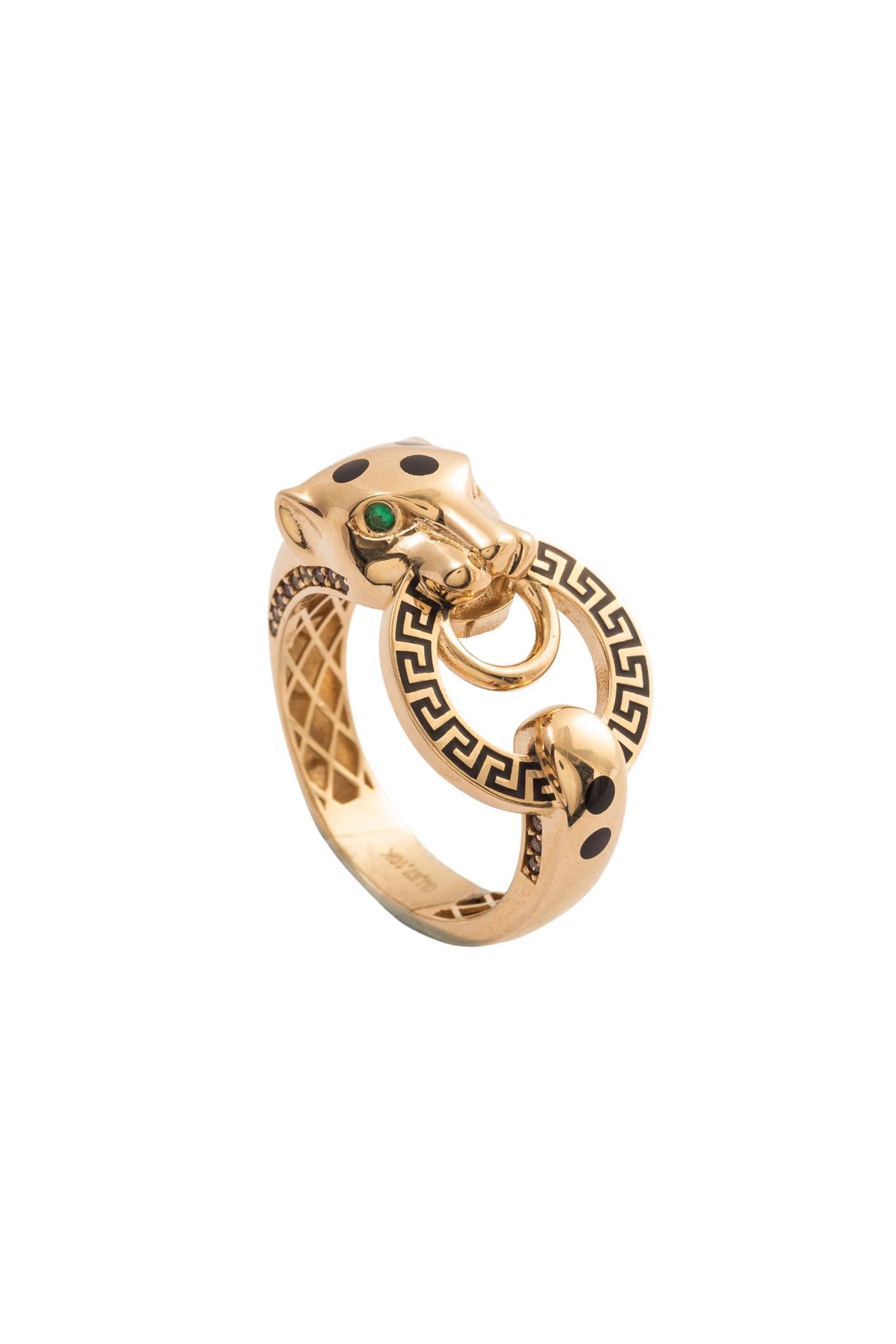 Anillo 10 kilates pantera ojos zirconias verdes y aro con grabado de grecas negras..png
