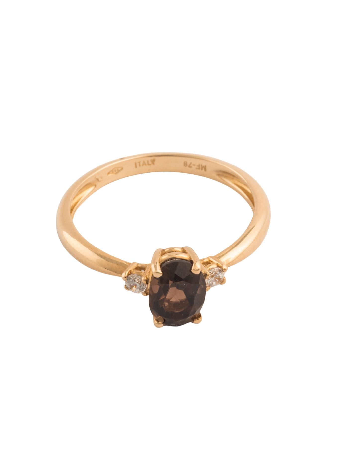 Anillo de oro sólido en 14 kilates con zirconia café y dos zirconias blancas minis a los lados..png