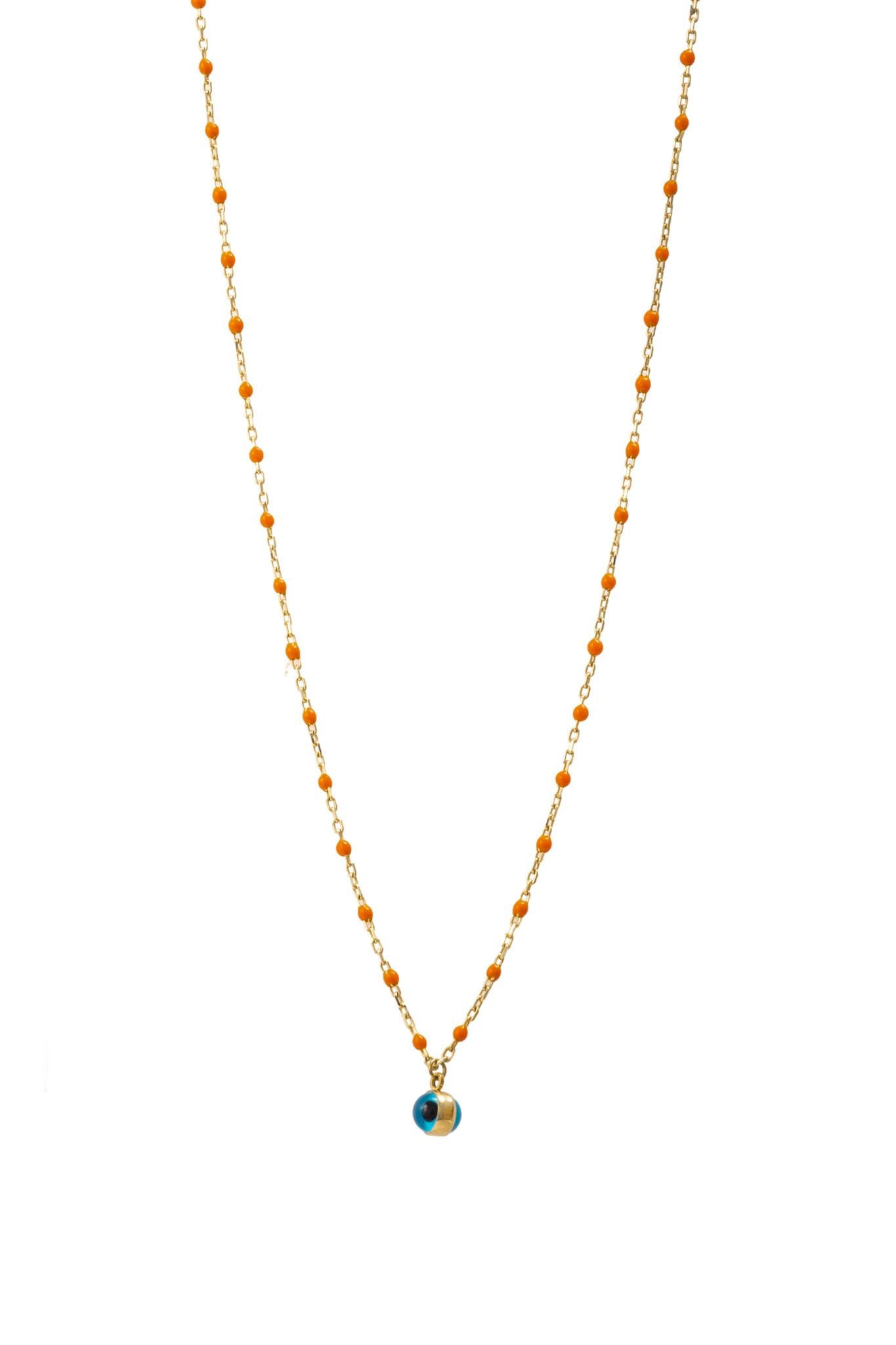 Cadena de oro solido de 10 kilates con bolitas naranjas alrededor y un ojo en el centro.png