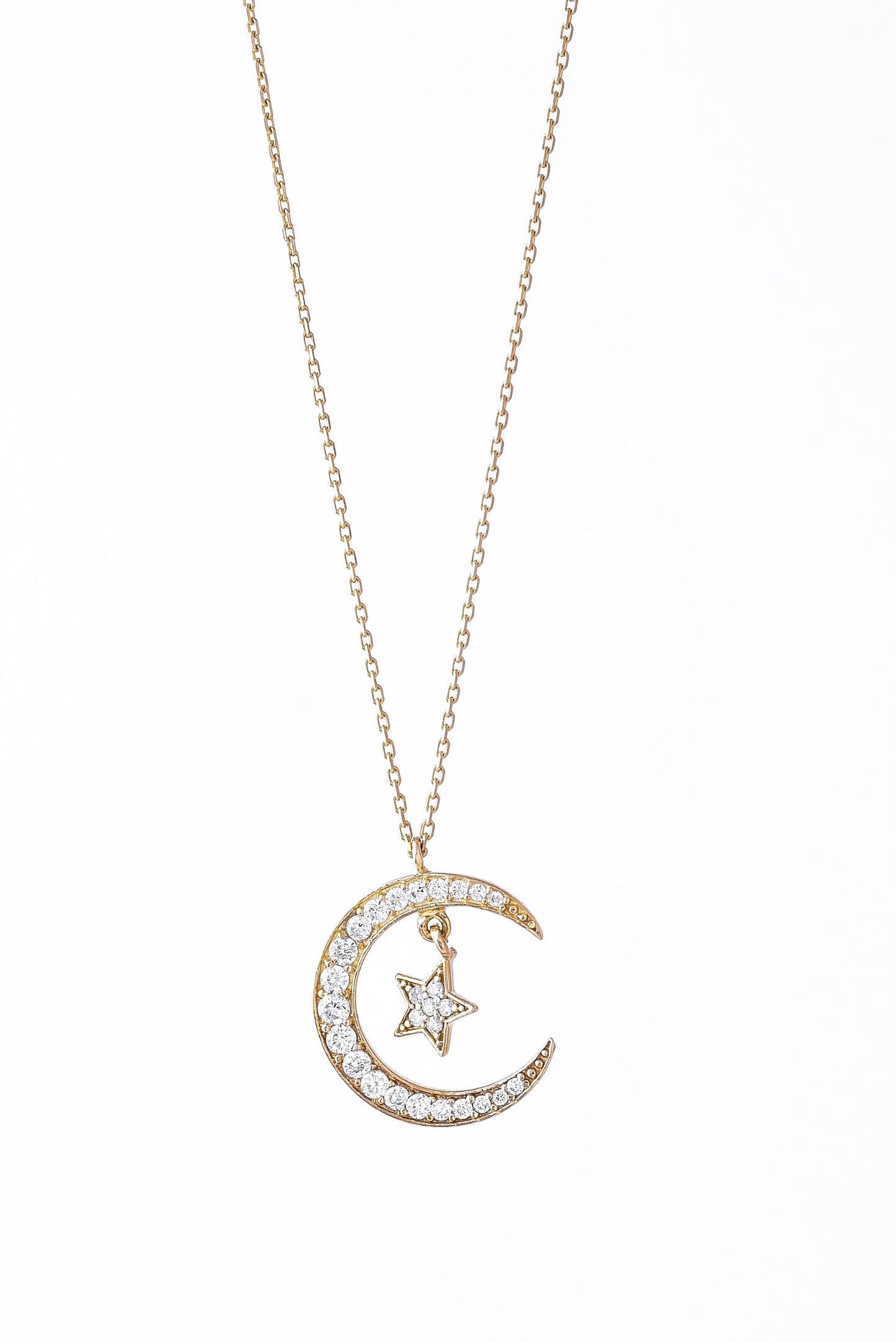Collar de oro sólido de 10 kilates con una luna con zirconias y estrella.png