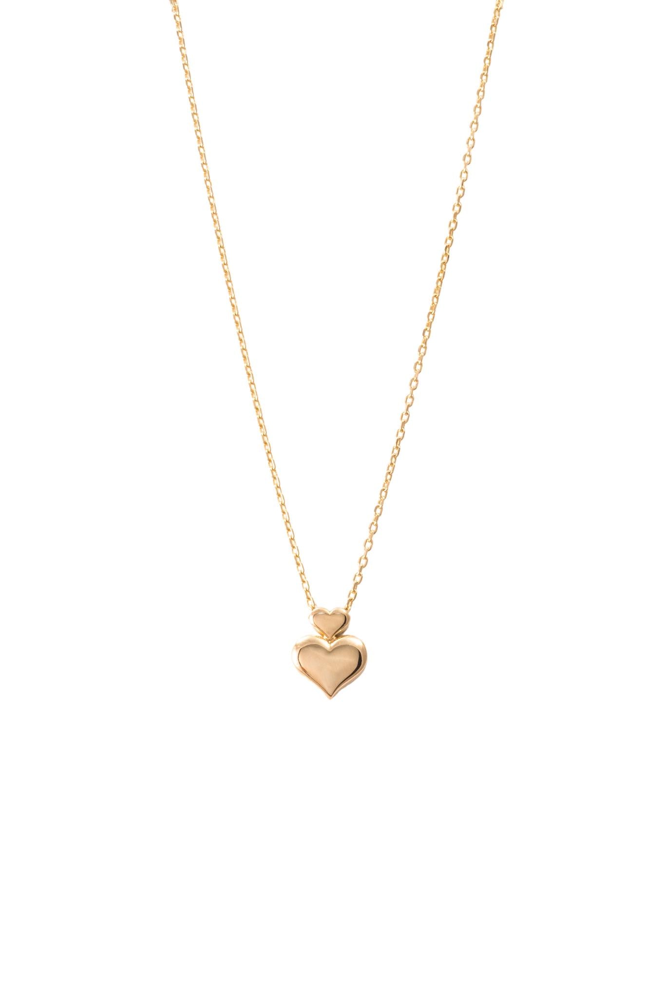 Gargantilla de oro solido en 10 kilates con un corazón liso en el centro.png