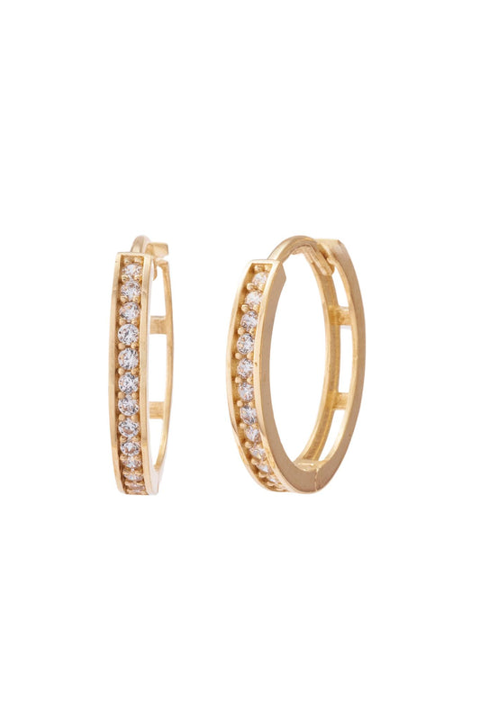 Huggie de oro solido en 10 kilates con zirconia en el centro y liso grande.png