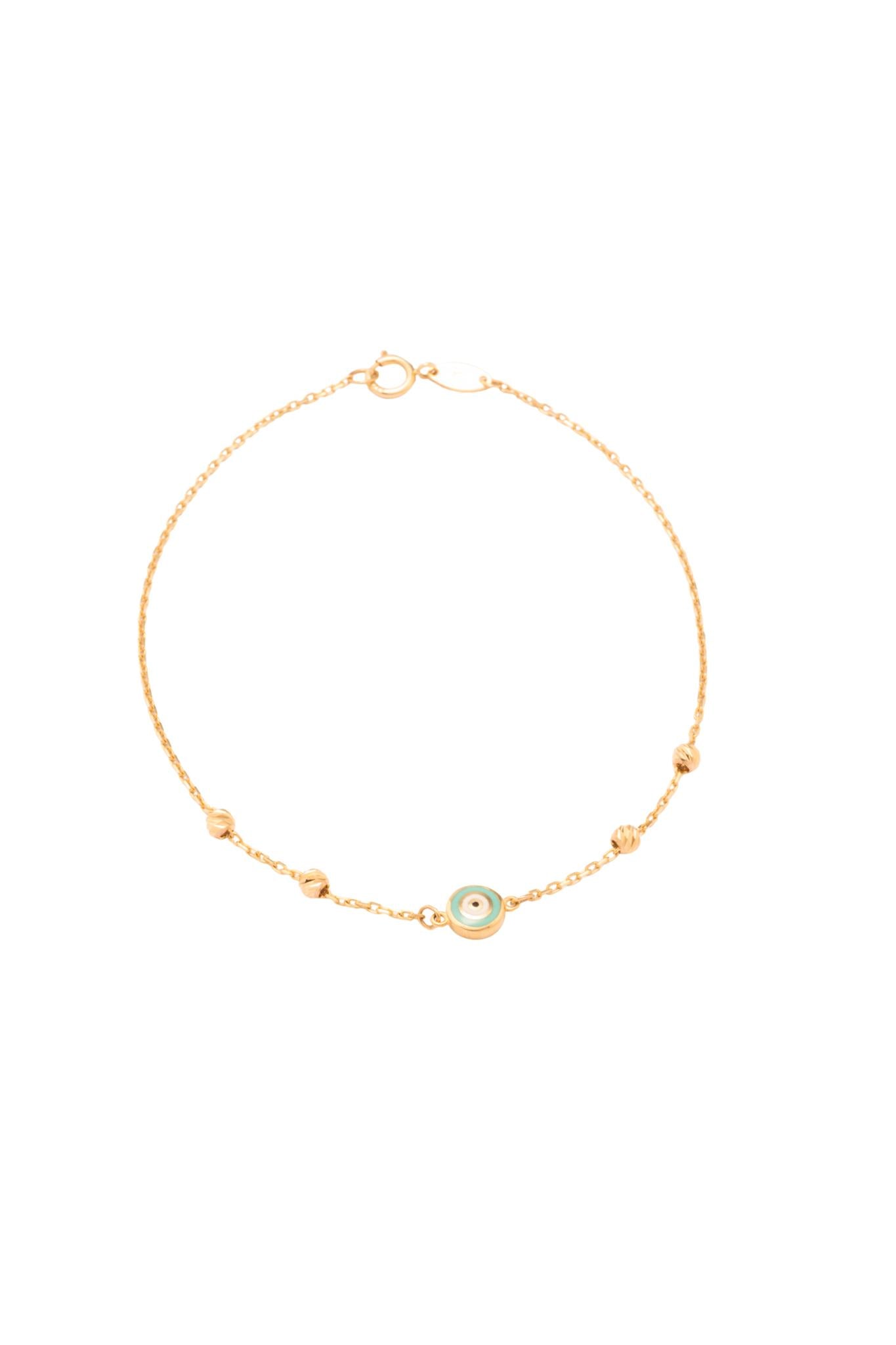 Pulsera 10 kilates 4 bolitas sencillas diamantadas y un ojo turco esmaltado..png