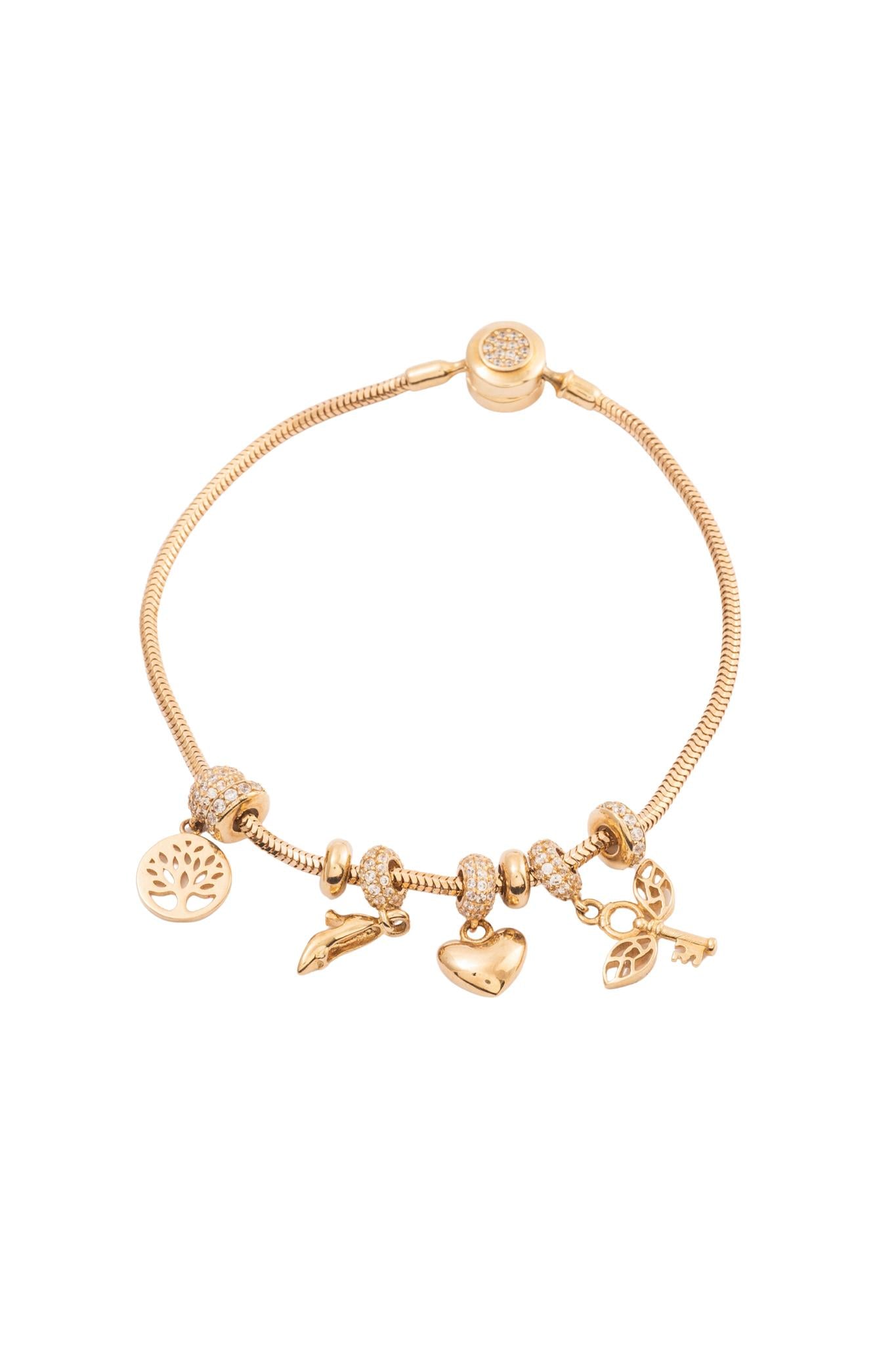 Pulsera 10 kilates con dijes charms variados y broche de zirconias con bisel..png