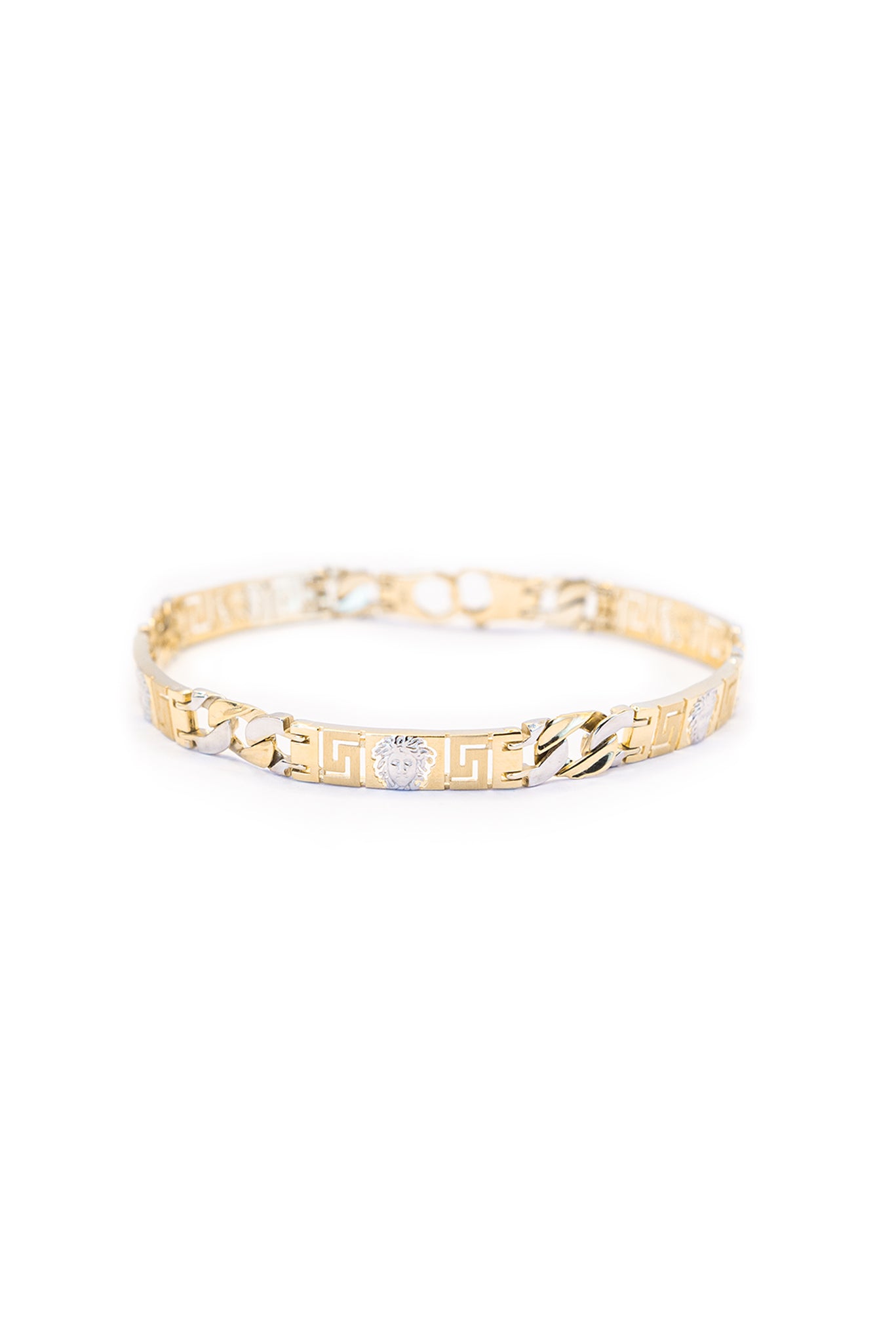 Pulsera 14 kilates con cabeza de medusa en oro blanco y eslabones cubanos oro amarillo y oro blanco intercalados..png