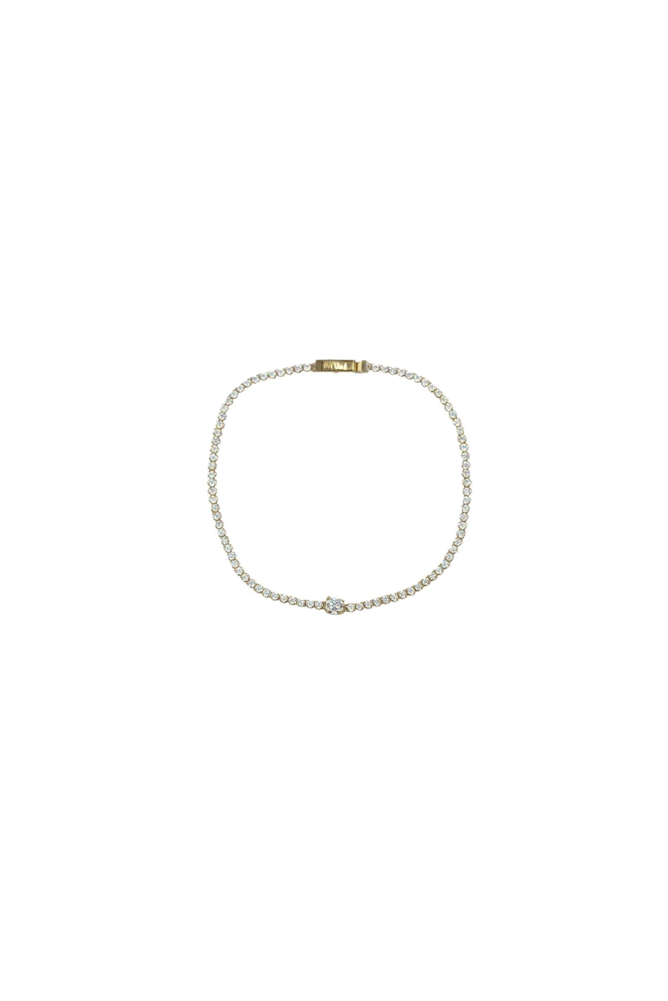 Pulsera de oro sólido de 10 en kilates con un estilo tenis con una zirconia en el centro.png
