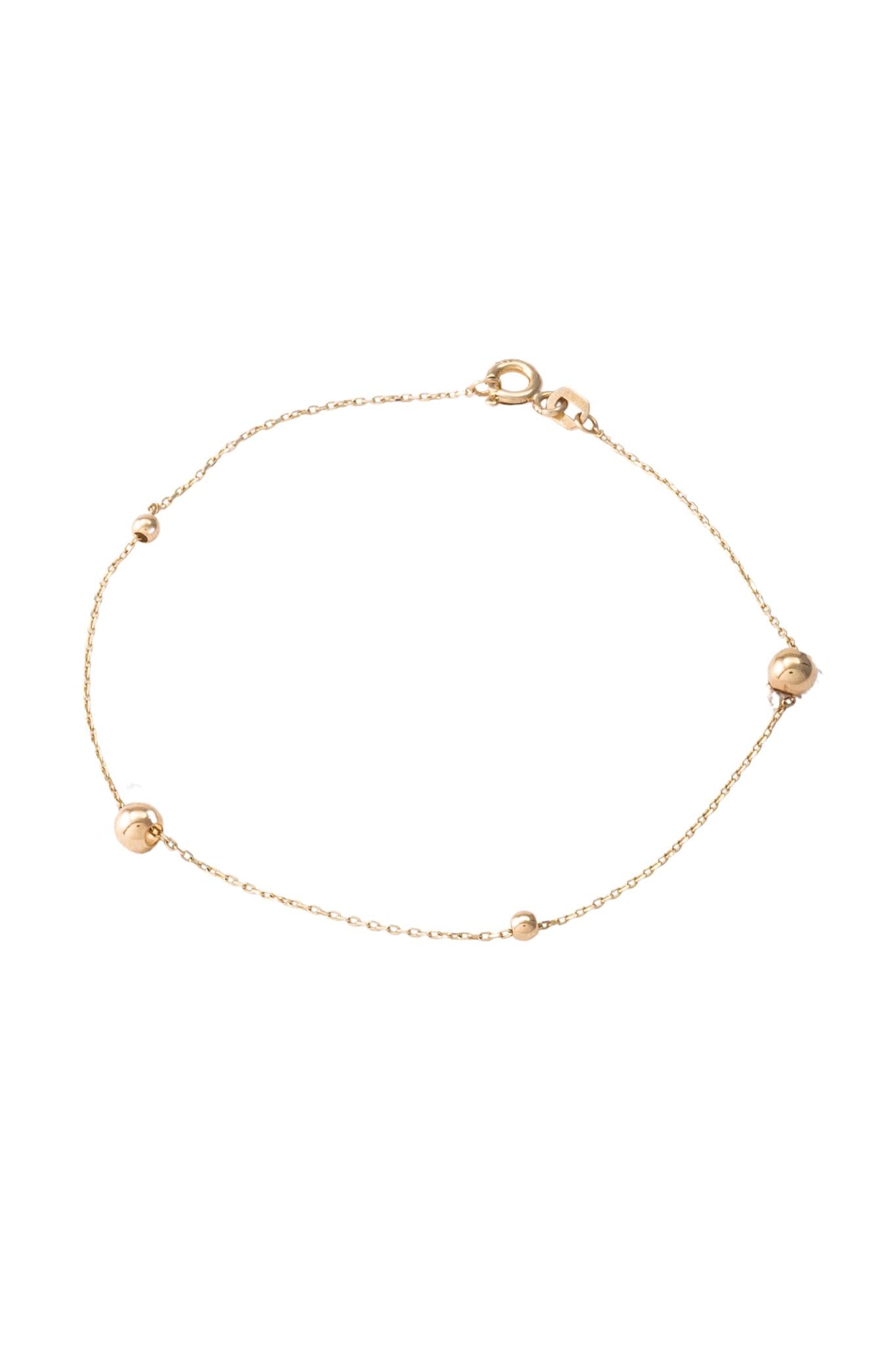Pulsera de oro sólido en 10 kilates con bolitas lisas diferentes tamaños..png