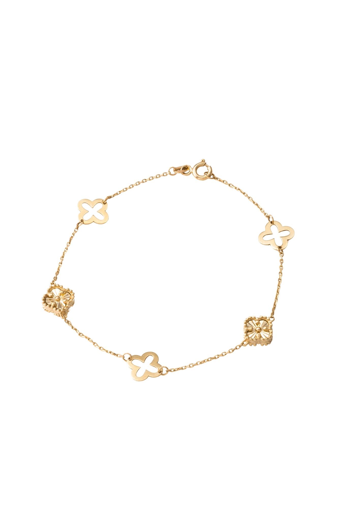 Pulsera de oro sólido en 10 kilates con flores de cuatro pétalos diamantadas y hueca lisa intercaladas..png