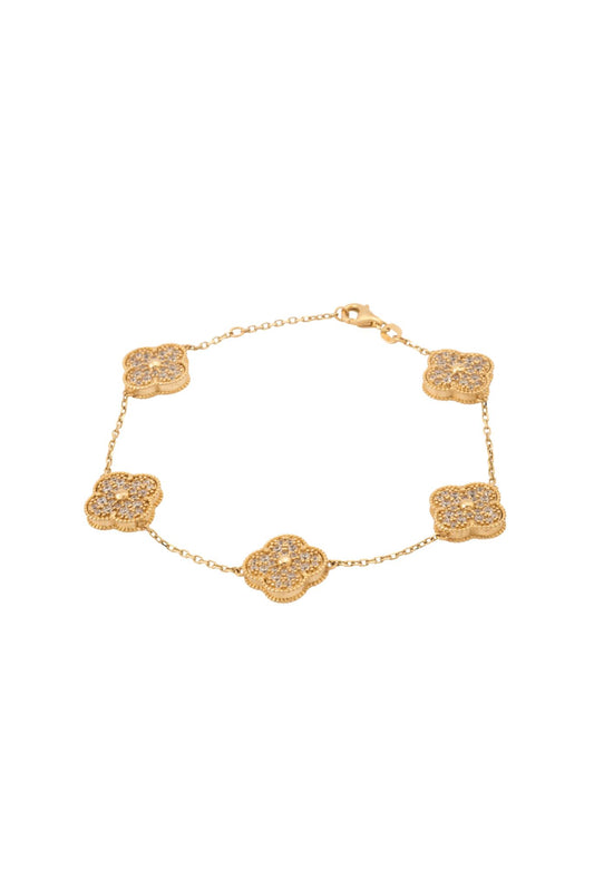 Pulsera de oro sólido en 10 kilates con flores de cuatro pétalos tupido de zirconias grandes..png