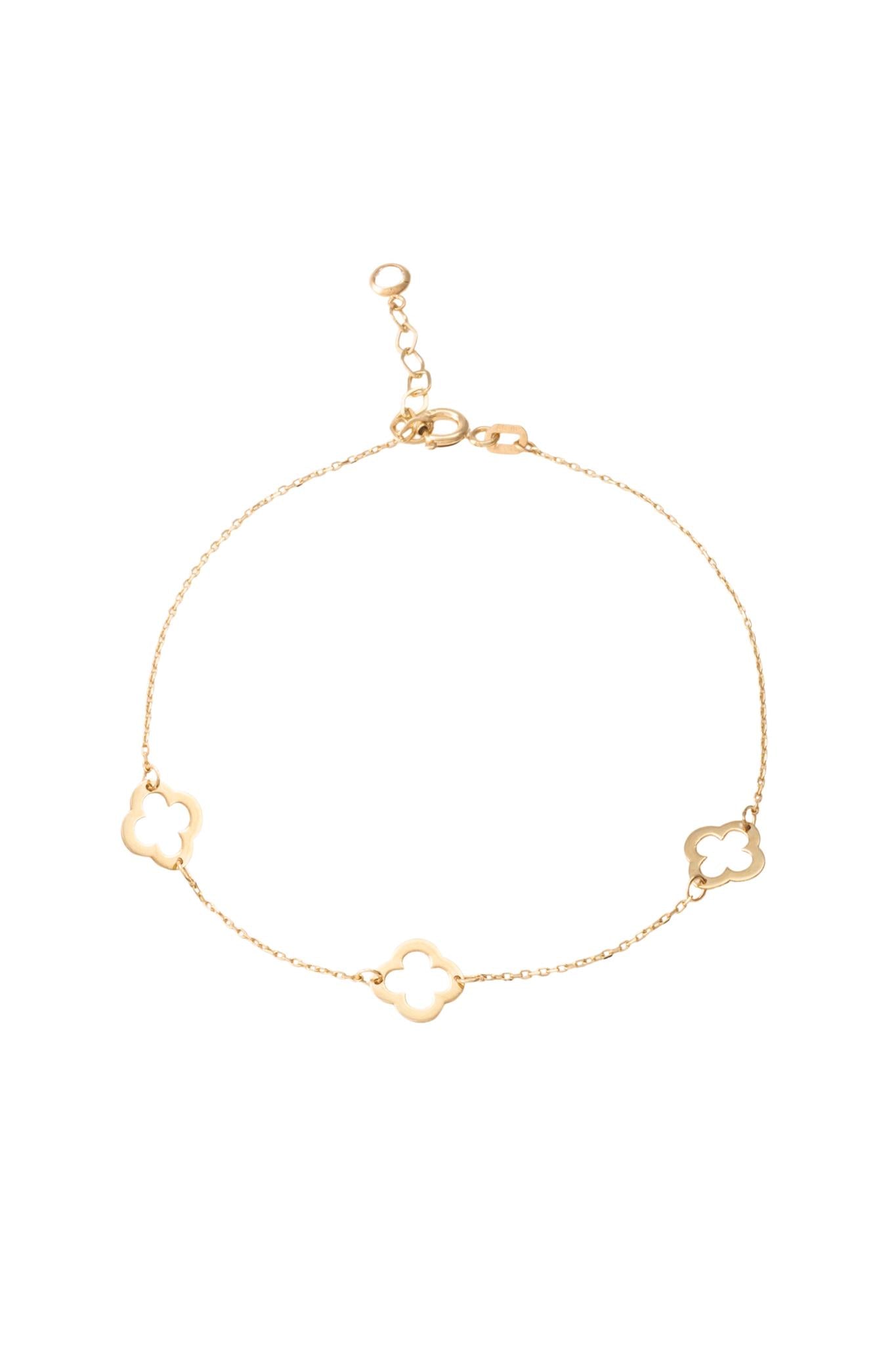 Pulsera de oro sólido en 10 kilates con tres flores de cuatro pétalos contorno lisos..png