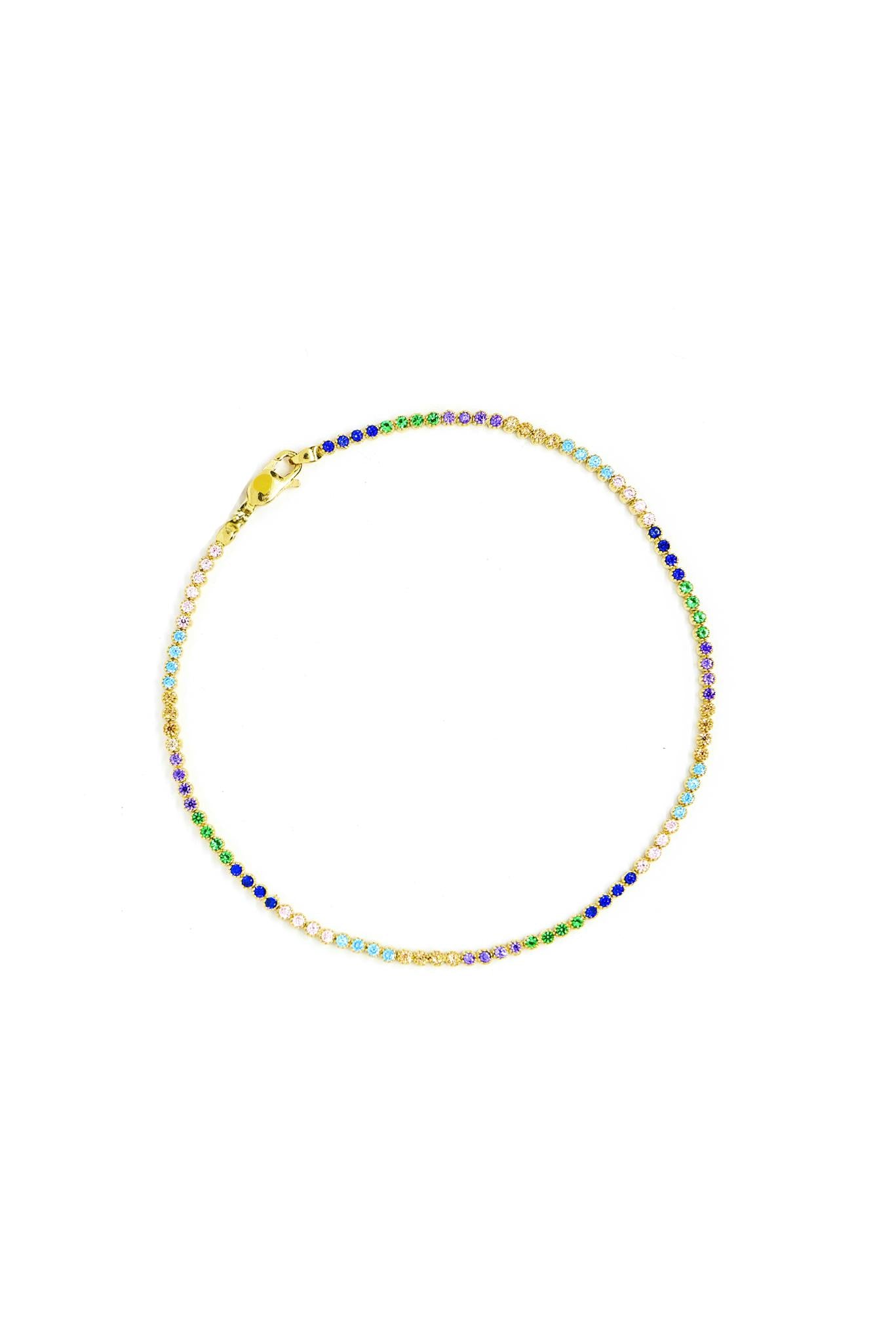 Pulsera de oro sólido en 14 kilates con tejido tenis y zirconias de colores .png