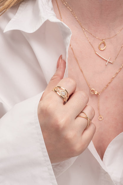 Anillo 10 kilates brazo doble en forma de X liso y zirconias