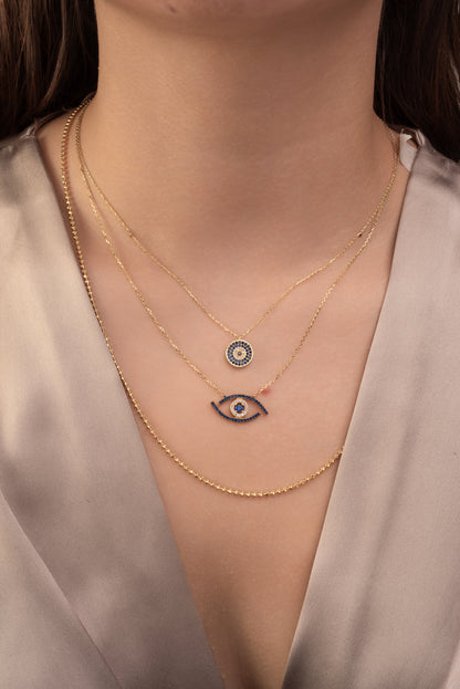 Gargantilla 10 kilates ojo de zirconias azules y blancas grande