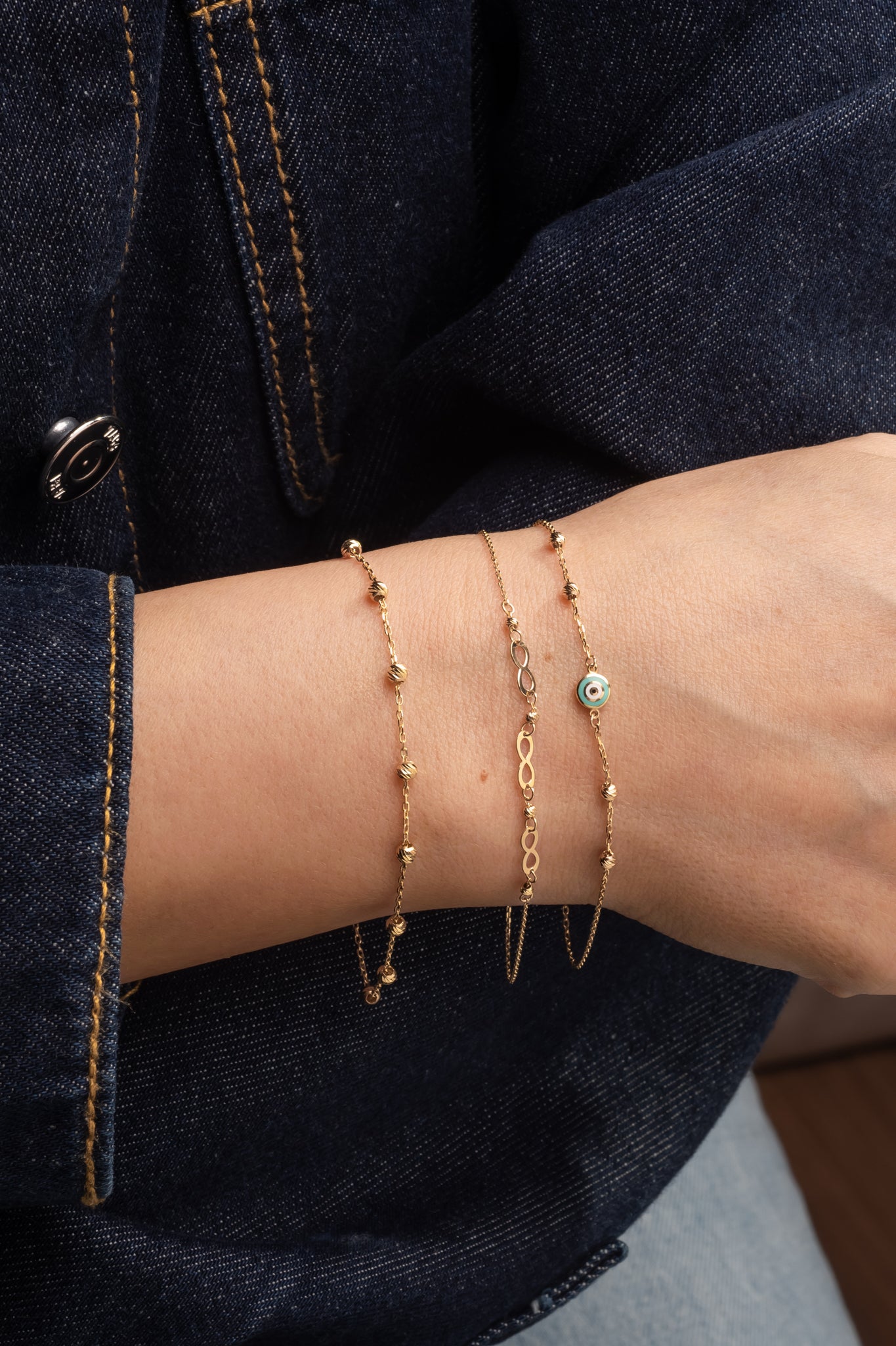 Pulsera 10 kilates 3 infinitos lisos.