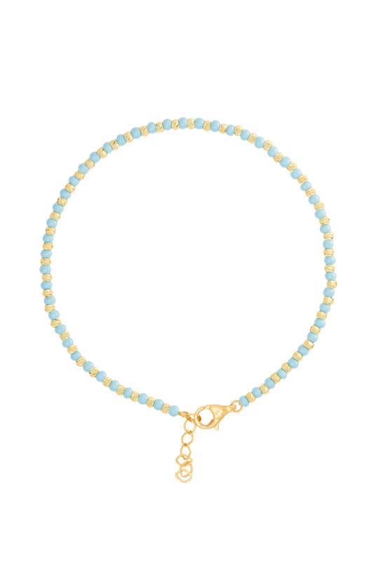Pulsera 10 kilates bolitas azules y amarillas diamantadas.