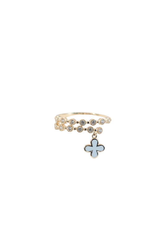 Anillo 10 kilates brazo doble zirconias y dije flor blanca..png