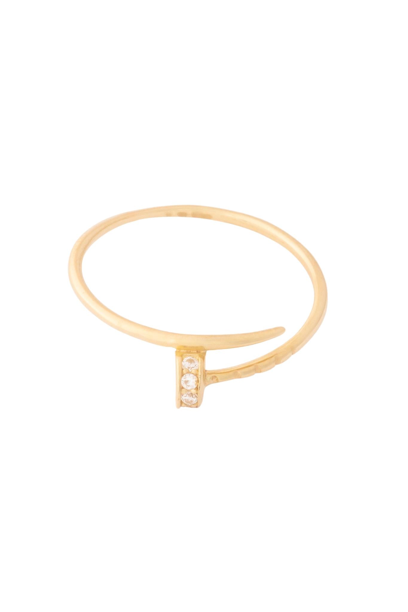 Anillo 10 kilates con forma de clavo fino y zirconias..png