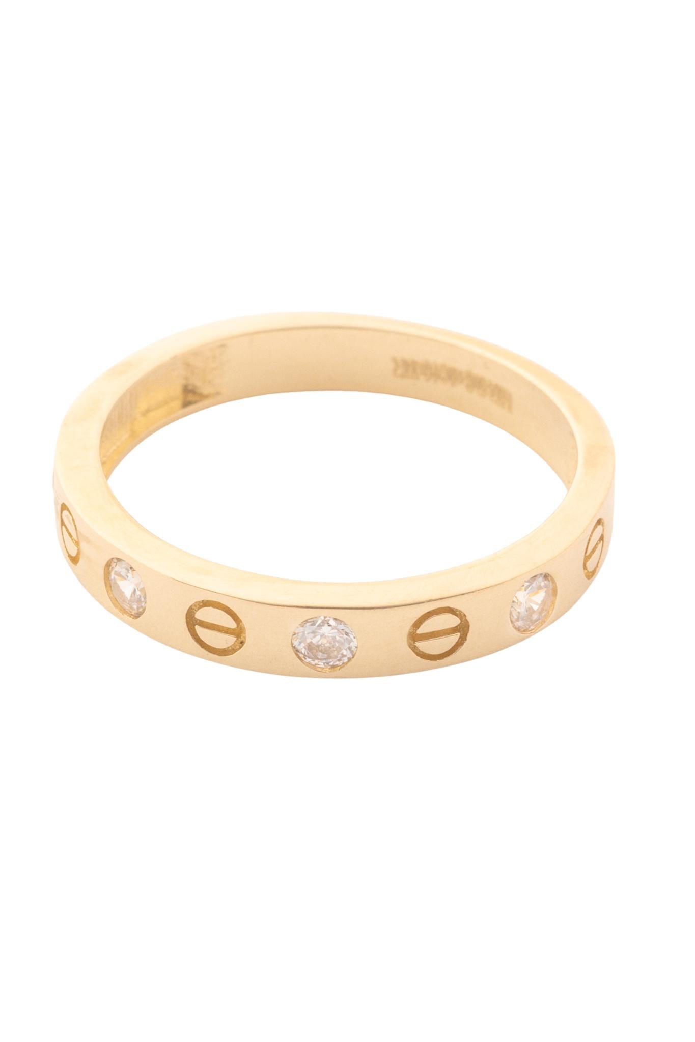 Anillo 10 kilates con forma de clavos y zirconias intercalados..png