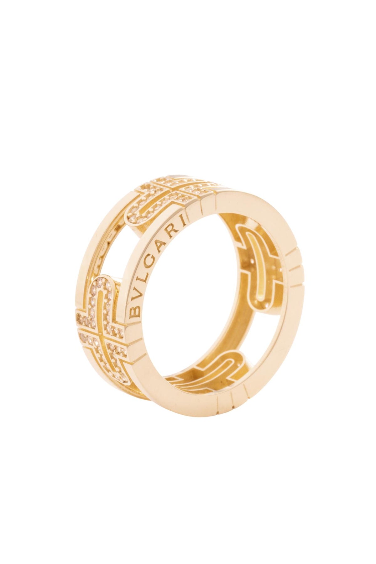 Anillo 10 kilates, doble hilera lisa, laterales grabados, grecas y zirconias centrales..png