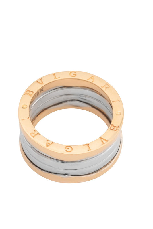 Anillo 10 kilates forma de cilindro parte superior e inferior dorada centro en oro blanco.png