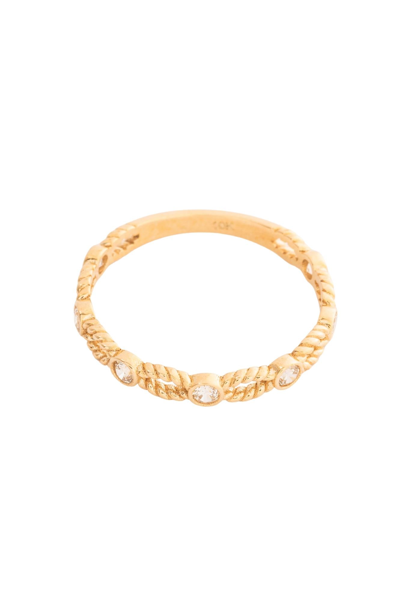 Anillo 10 kilates semilla hueca y zirconia biselada intercalados..png