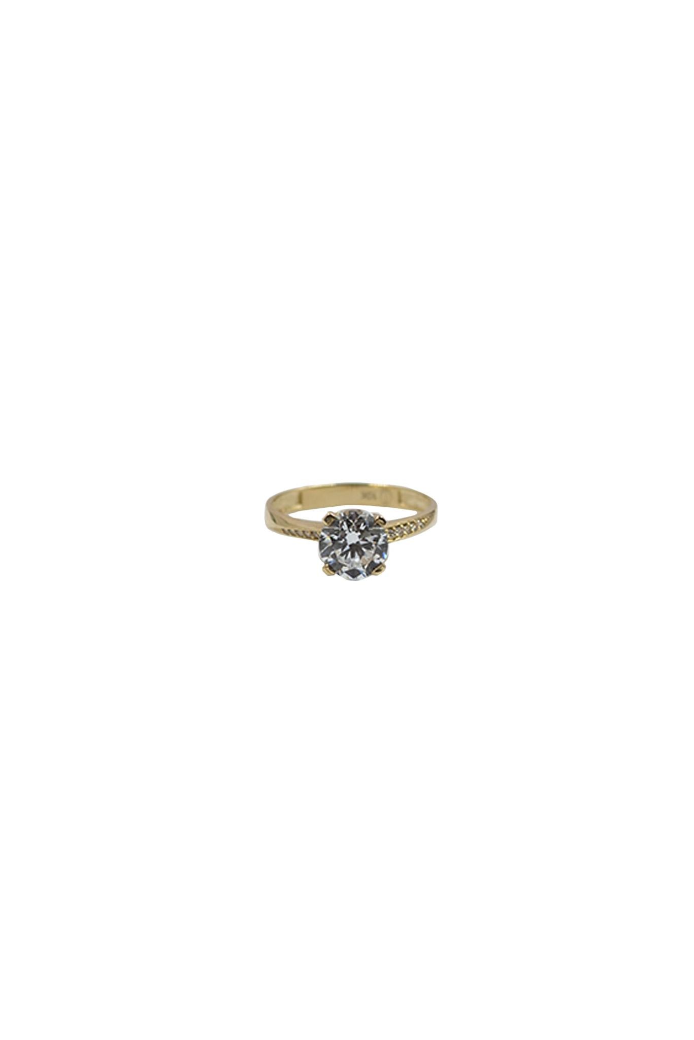 Anillo de compromiso de oro sólido en 10 kilates con una zirconia en medio y al rededor zirconias.png