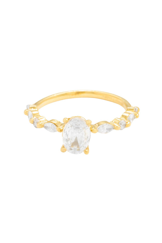 Anillo de compromiso en 10 kilates con zirconia ovalada y brazo de zirconias.png