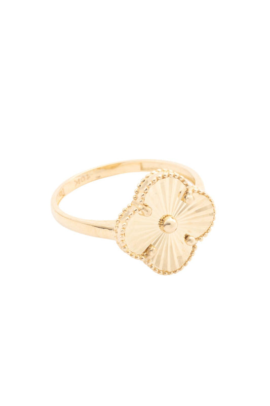 Anillo de oro sólido en 10 kilates con flor de cuatro pétalos diamantada al centro..png