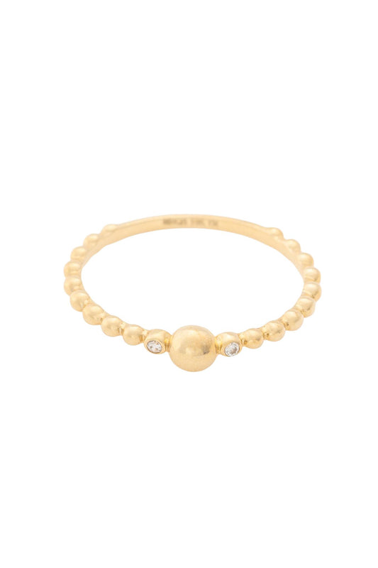 Anillo de oro sólido en 10 kilates con un contorno de bolitas y una bolita grande en el cento y a las lados una zirconia.png