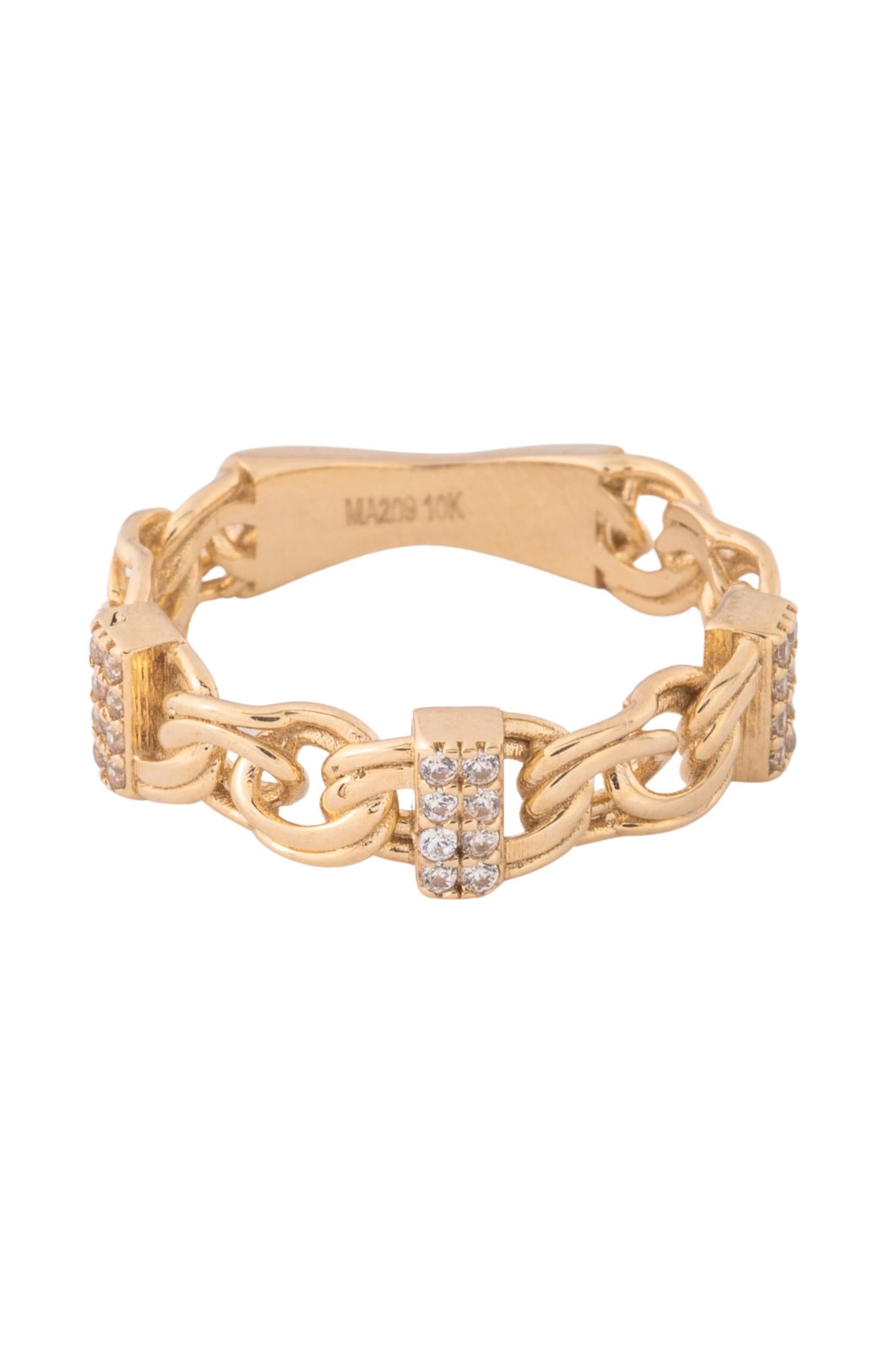 Anillo de oro solido en 10 kilates con un estilo cruzado de candado con una parte con zirconia y la otra lisa .png