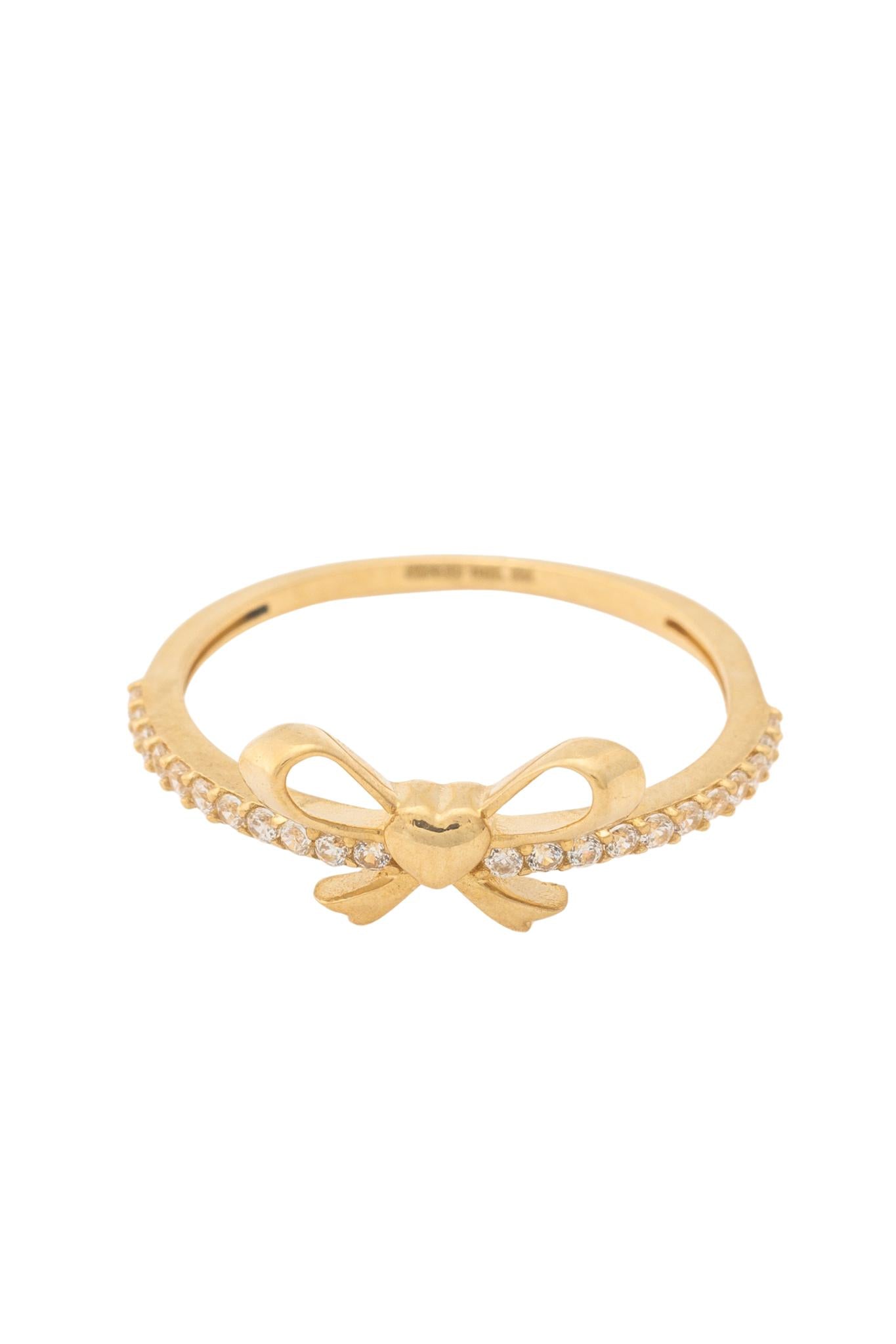 Anillo de oro sólido en 10 kilates con una contorno de zirconia y un moño dorado en el centro .png