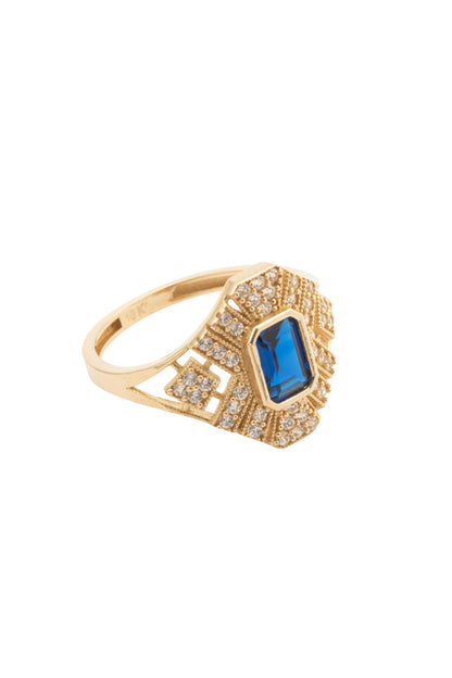 Anillo de oro sólido en 10 kilates con zirconia azul en forma rectangular al centro y contorno de grecas grandes de zirconias..png