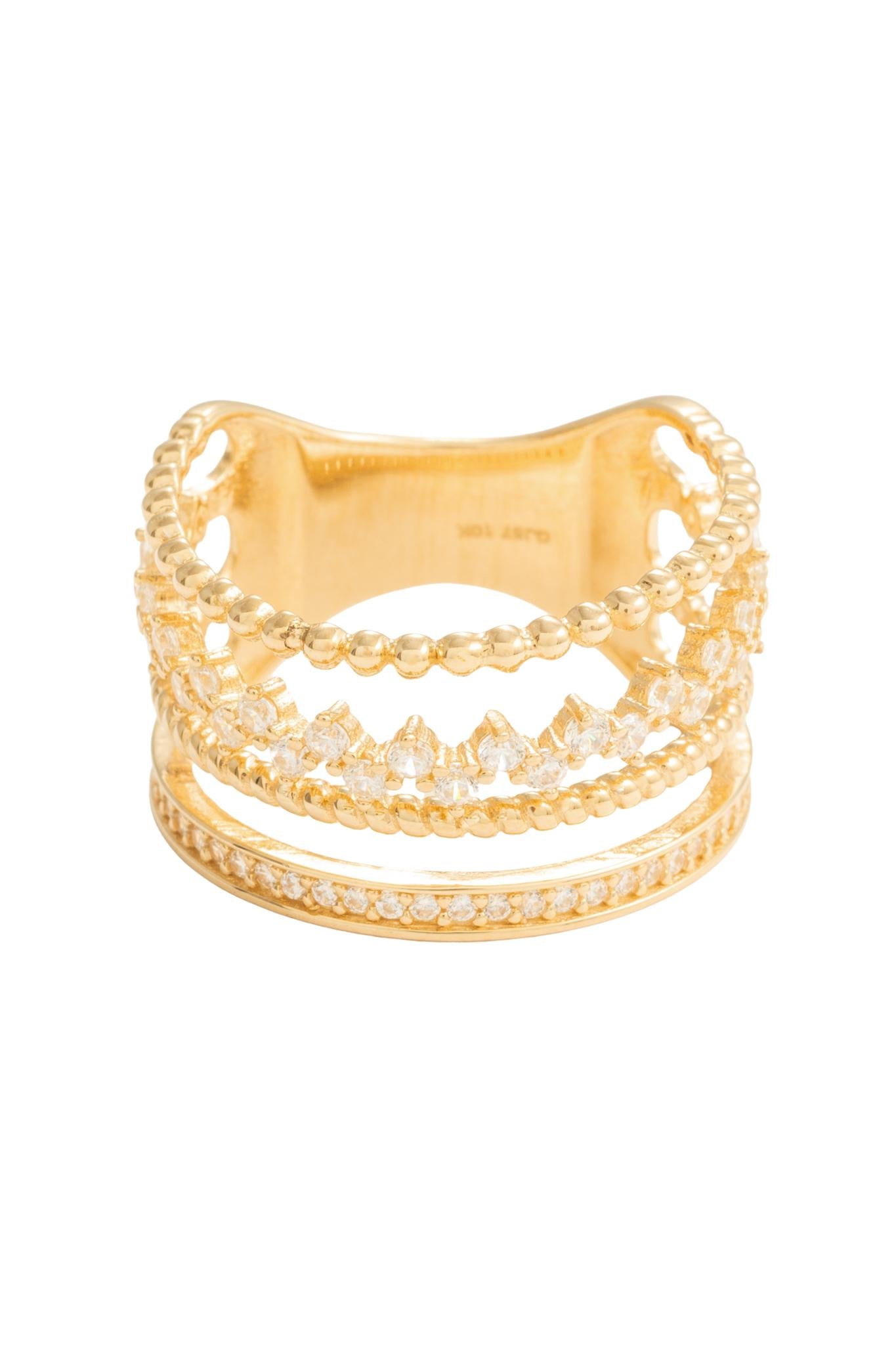 Anillo en 10 kilates con cuatro brazos de bolitas, zirconias, tejido cuerda y churumbela biselada.png
