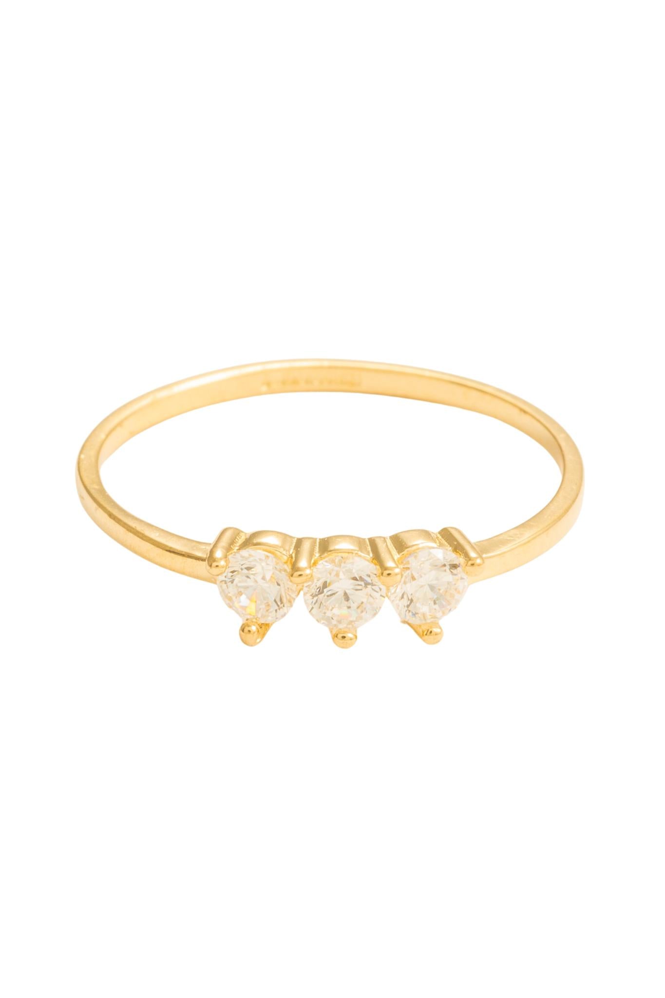 Anillo en 10 kilates con tres zirconias blancas circulares.png
