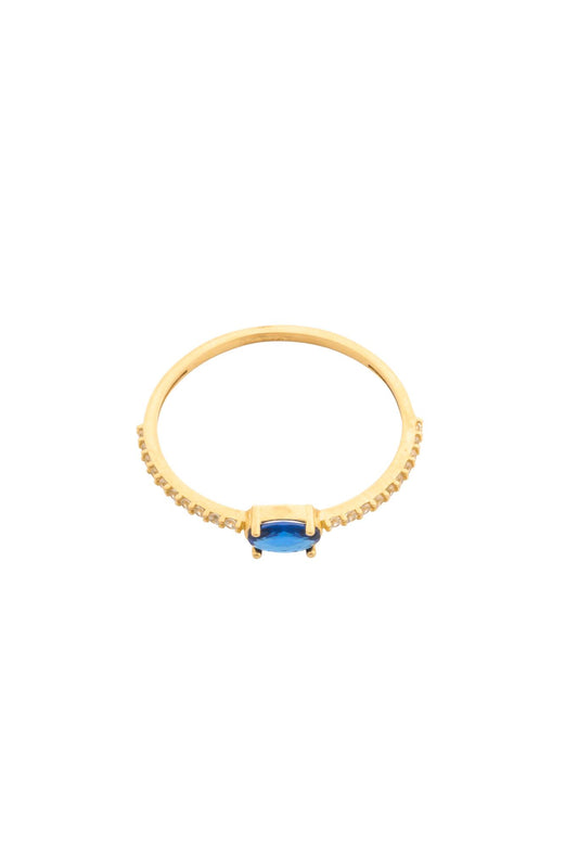 Anillo en 10 kilates con zirconias y zirconia ovalada azul.png