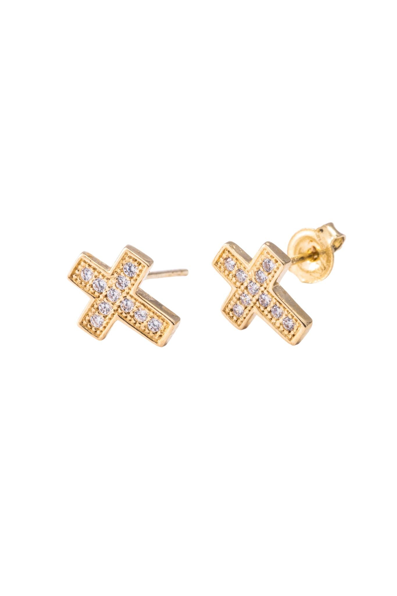 Arete de oro solido en 10 kilates con forma de cruz con zirconia con un contorno dorado .png