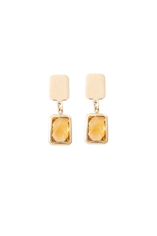 Arete de oro solido en 10 kilates con una placa lisa en al parte de arriba y colgando una piedra dorada con contorno dorado.png