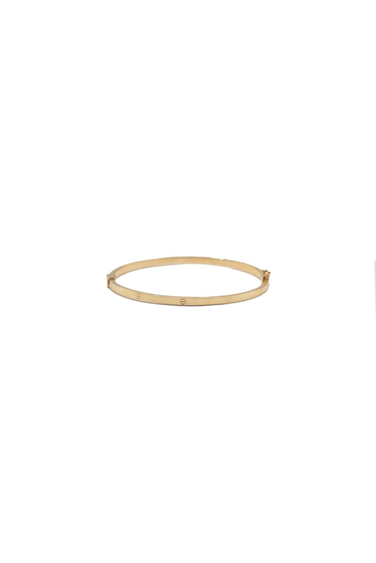 Aro de oro sólido en 10 kilates con un sello de clavo al rededor.png
