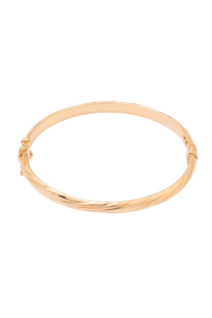 Aro de oro sólido en 14 kilates con diseño de torsal ligero..png