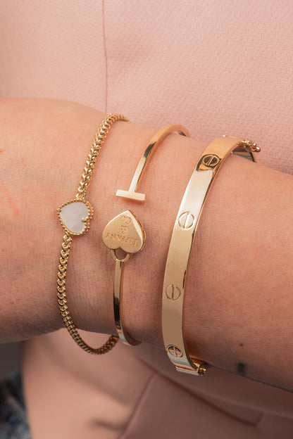 Pulsera aro de oro sólido en 10 kilates con formas de tornillos lisos grande.