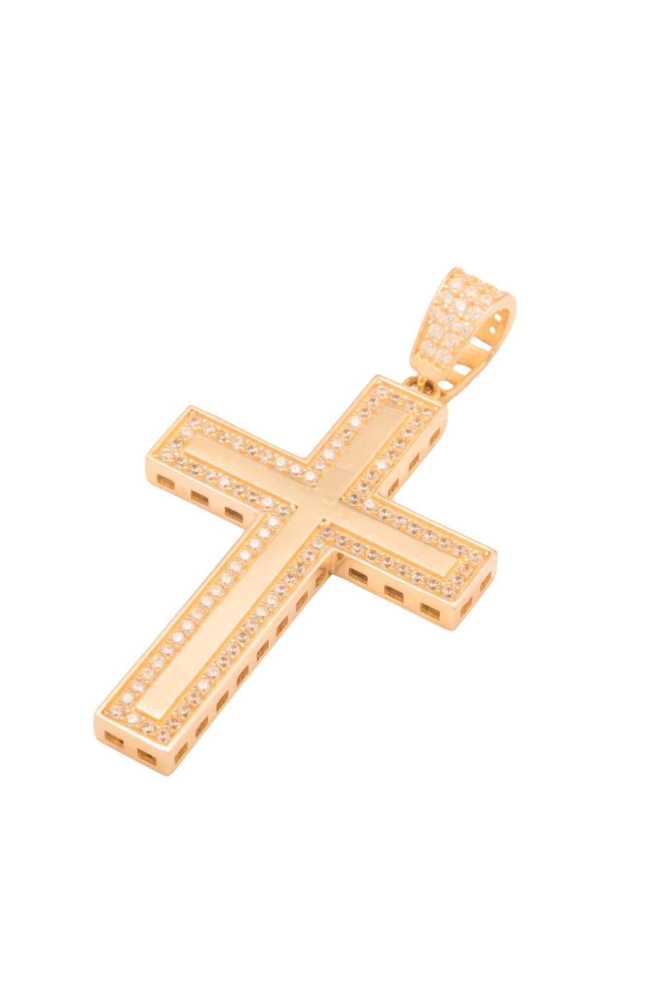 Dije 10 kilates forma de cruz rectangular, un asa de zirconia y un contorno ligero de zirconia alrededor..png