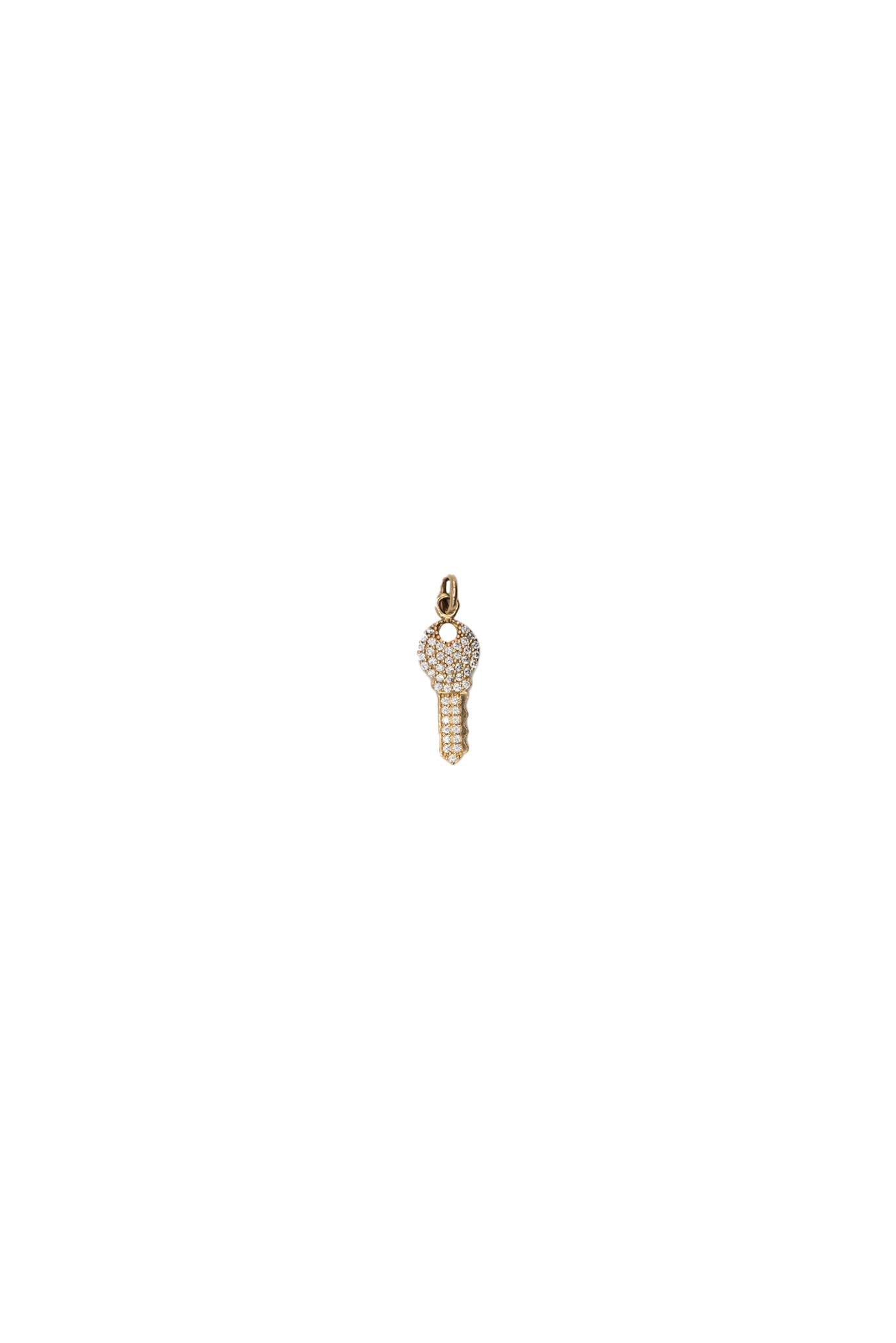 Dije de oro solido de 14 kilates con forma de llave con zirconias.png