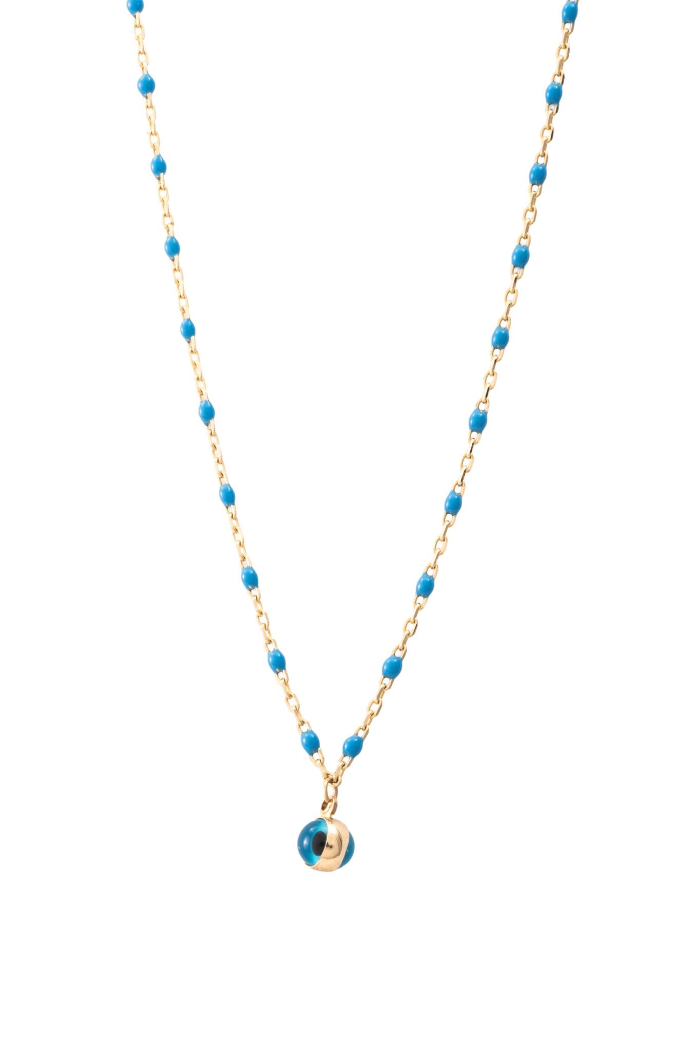 Gargantilla de oro solido en 10 kilates con bolitas color azul con un ojo turco en el centro.png