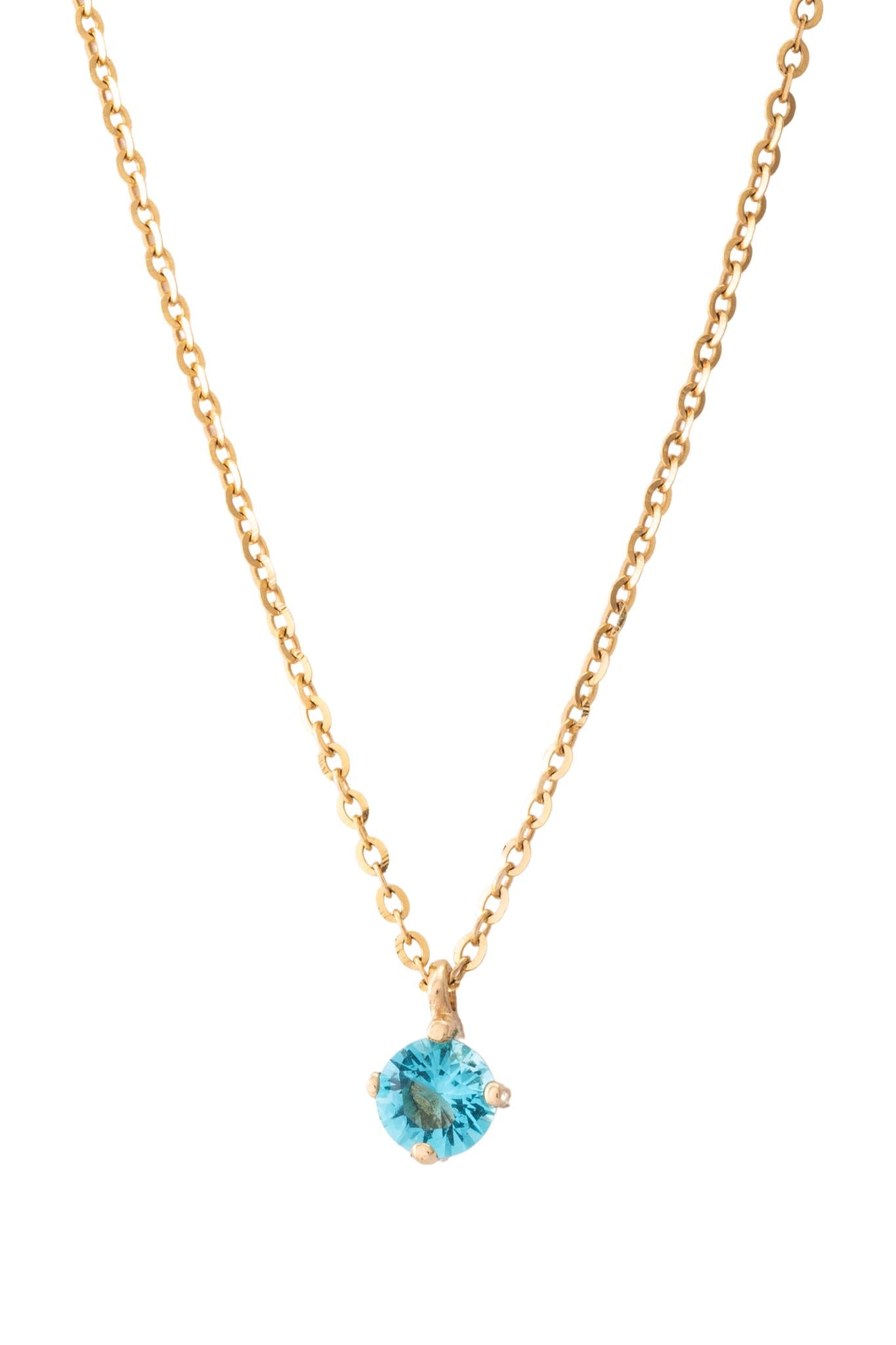 Gargantilla de oro solido en 10 kilates con una zirconia en el centro solitaria aguamarina.png