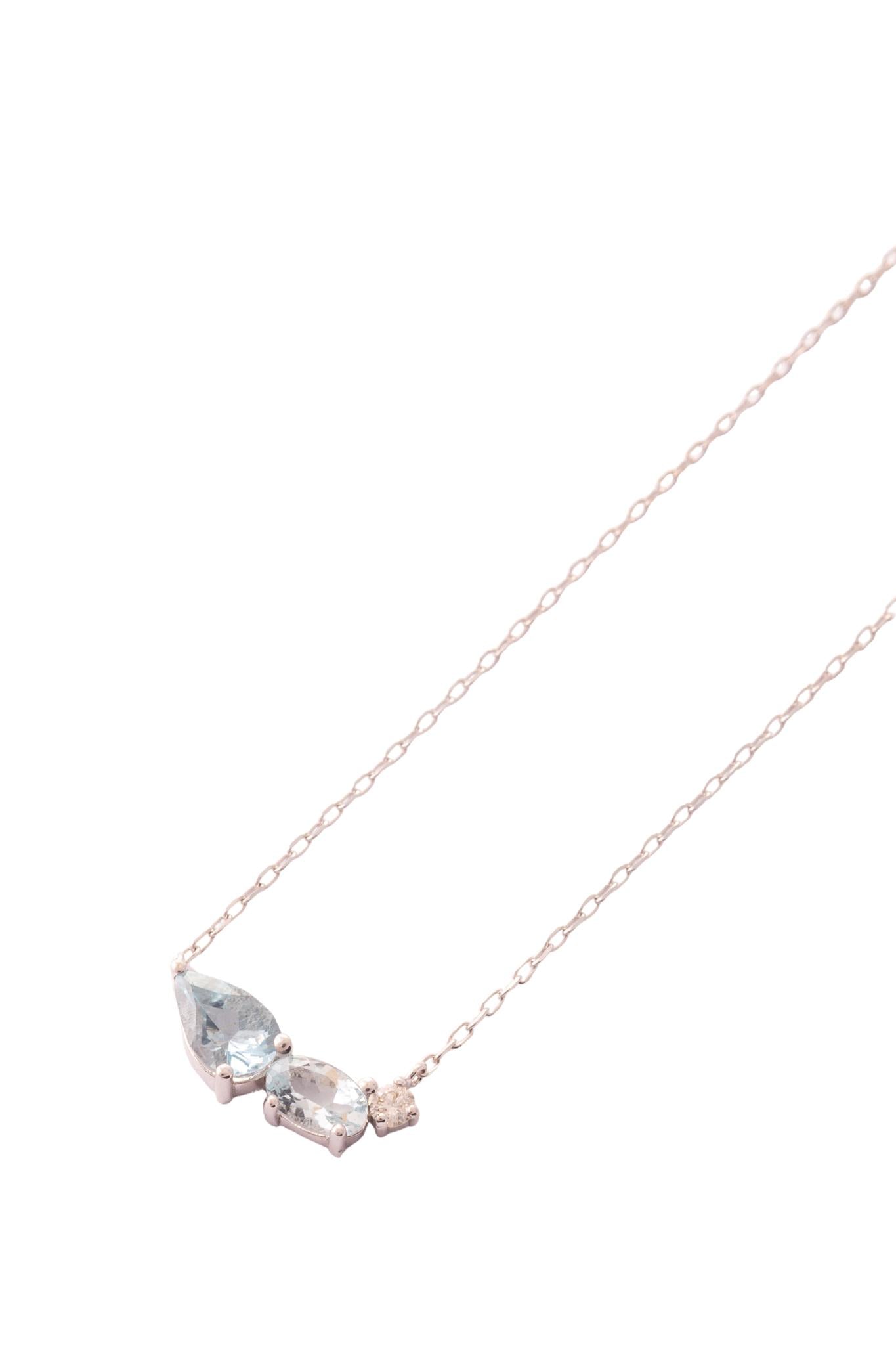 Gargantilla de oro sólido en 14 kilates con hoja doble de acuamarina y diamantes mubus de 0.035 cts montados sobre oro blanco..png