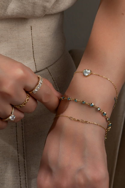 Pulsera en 10 kilates con ojitos azules biselados