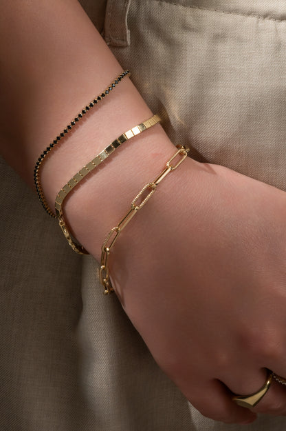 Pulsera en 10 kilates tipo tenis con zirconias negras