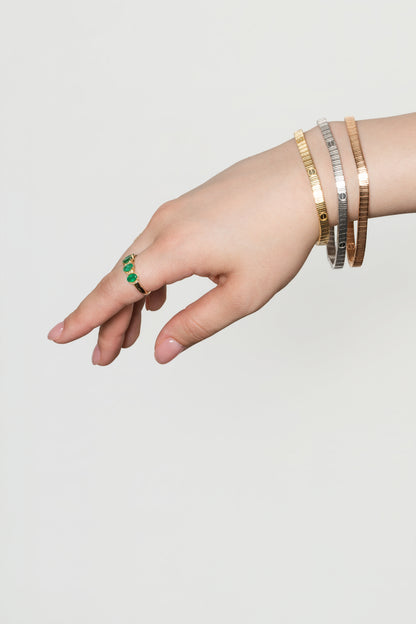 Pulsera de oro sólido en 14 kilates con lineas estilo diamantado con 6 marcas de clavo delgado en oro rosado