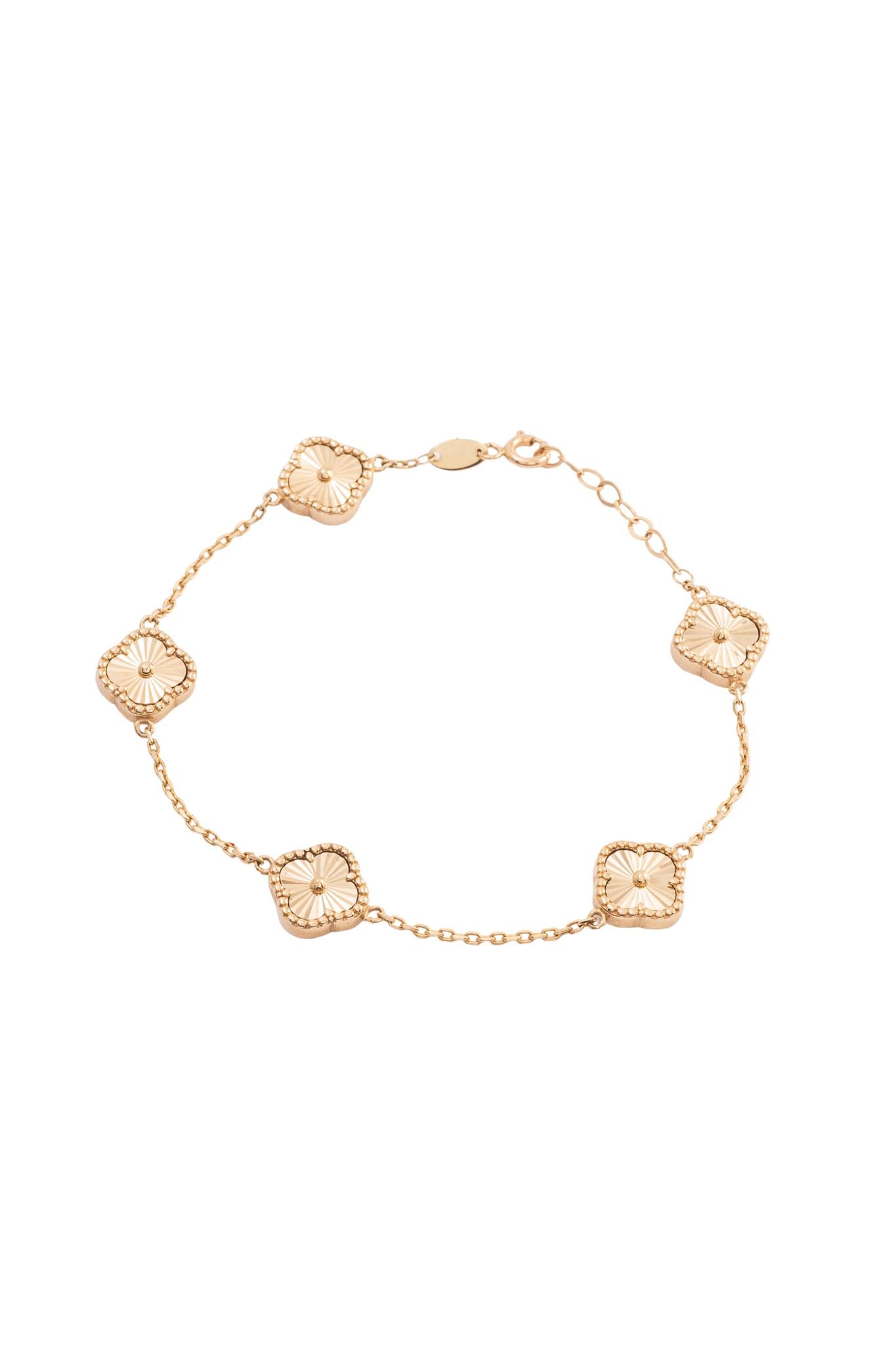 Pulsera 10 kilates con flores de cuatro pétalos diamantados..png